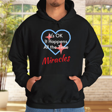 Gildan unisex hoodie with “Miracles Happen” design and uplifting message, Christian apparel made from soft cotton-poly blend, ideal for cooler weather and faith-inspired comfort, man in gray hoodie